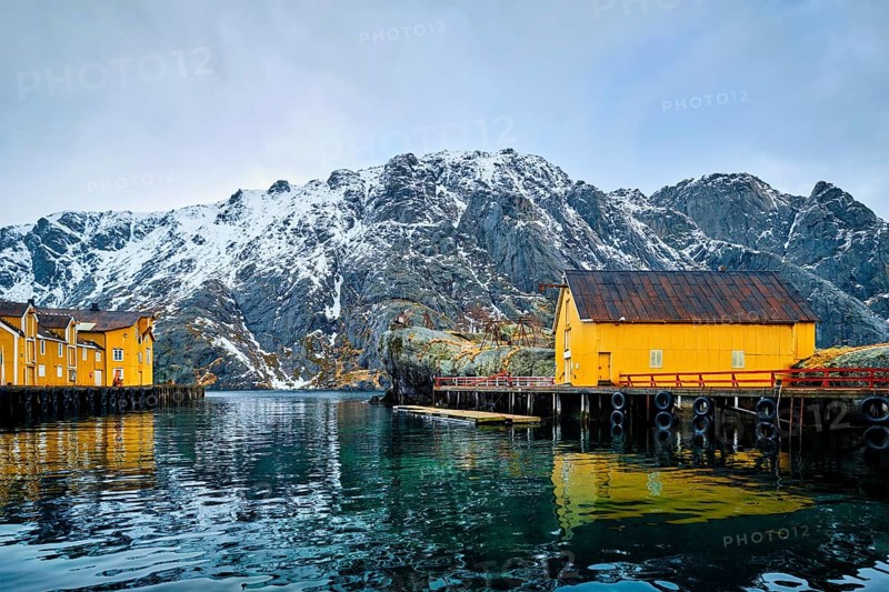 Nusfjord authentic fishing village in winter with red rorbu houses. Lofoten islands