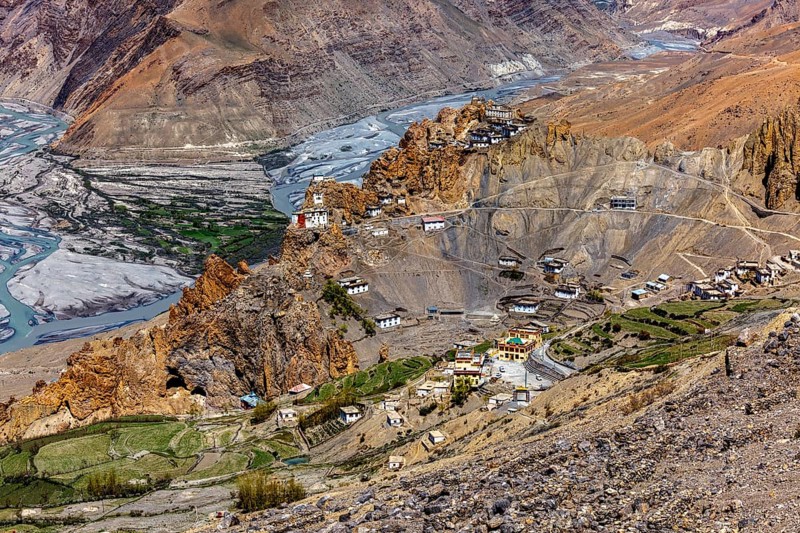 Dhankar Monastery perched on a cliff in Himalayas and village