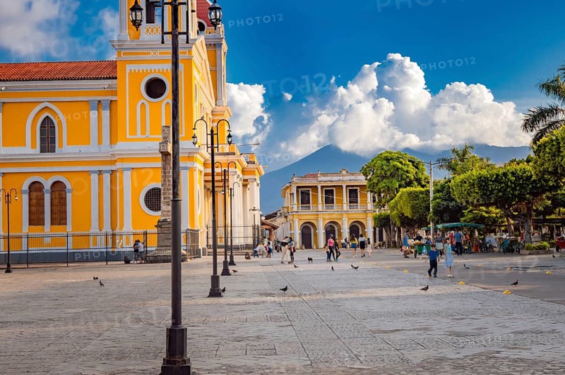 Beautiful plaza with people around in a sunset