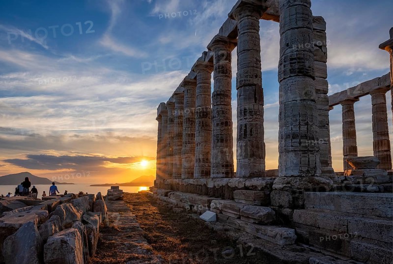 Cape Sounio sunset at Sounion with ruins of the iconic Poseidon temple. One of the Twelve Olympian Gods of ancient Greek religion and mythology. God of the sea