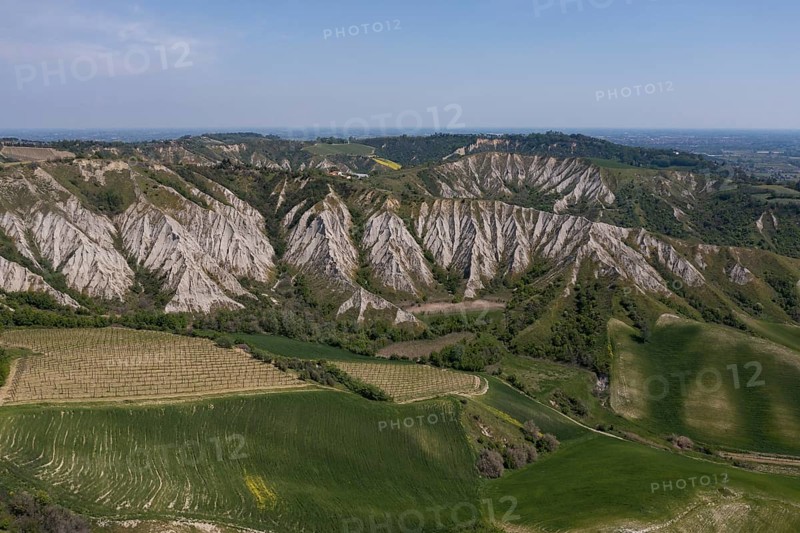 Aerial view of a hilly landscape with erosion valleys