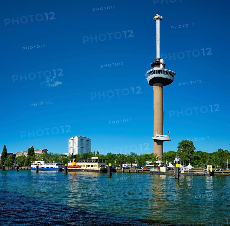 Rotterdam cityscape with Euromast observation tower and tourist boat on Nieuwe Maas river
