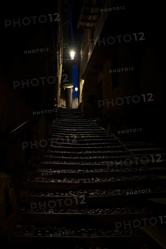 Narrow dark alley with stairs in Cannobio