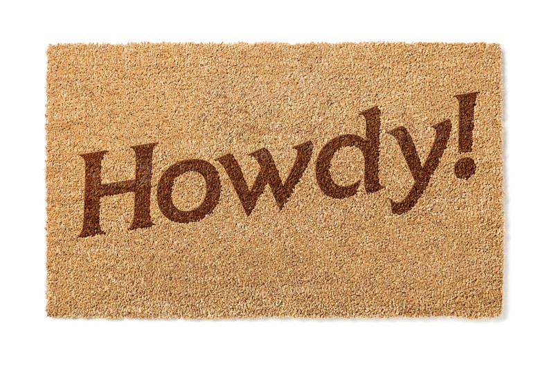 Howdy welcome mat isolated on A white background