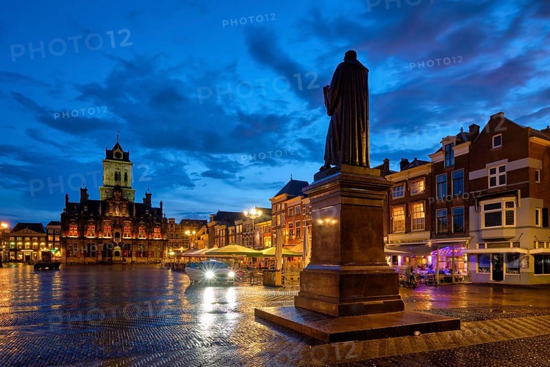 Delft City Hall and Delft Market Square Markt with Hugo de Groot Monument in the evening