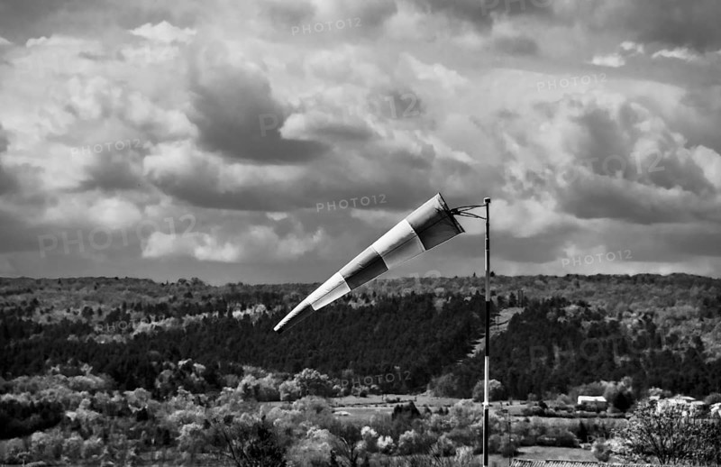 Windsock and cloudy sky