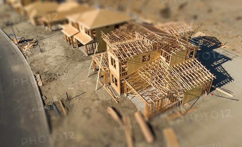 Aerial view of new homes construction site with tilt-shift blur