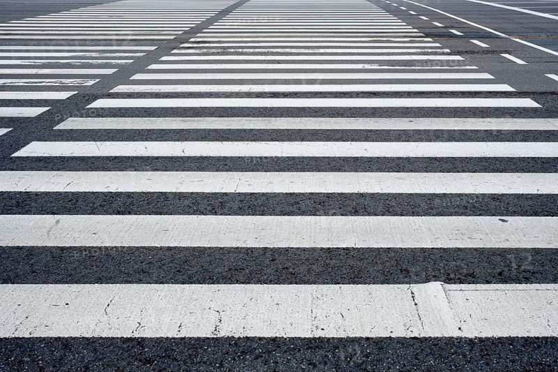 Crosswalk pedestrian crossing on asphalt road in the street