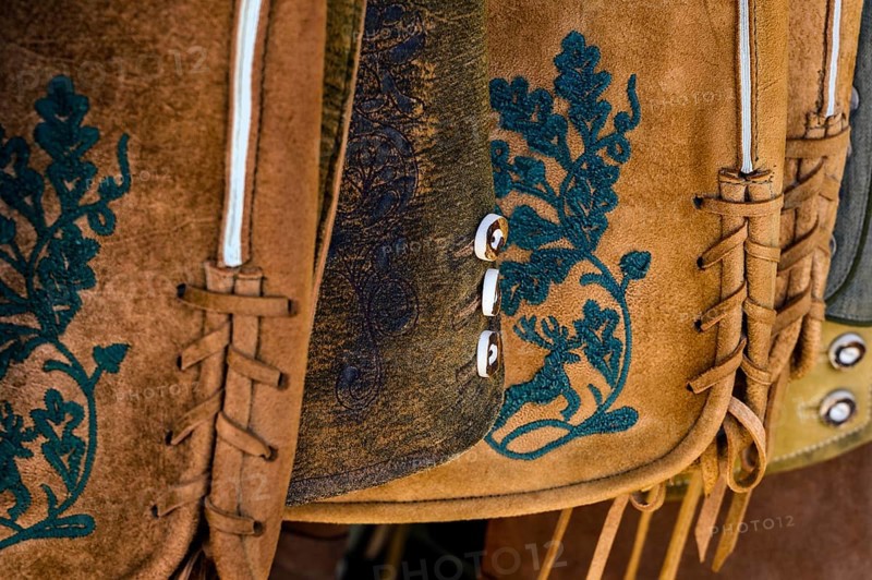 Embroidery and staghorn buttons on leather trousers