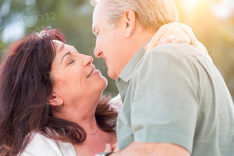 Happy middle aged couple enjoy A romantic slow dance outside