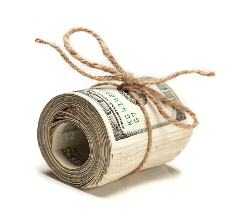 Roll of one hundred dollar bills tied in burlap string on white
