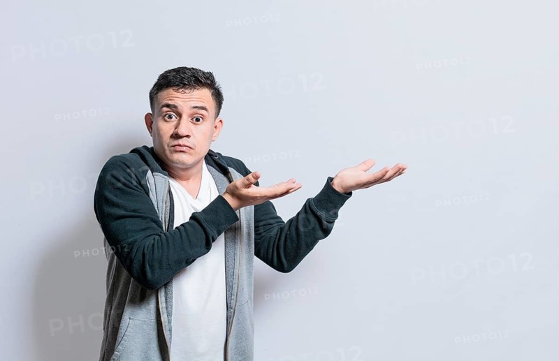 Person pointing palms to the side