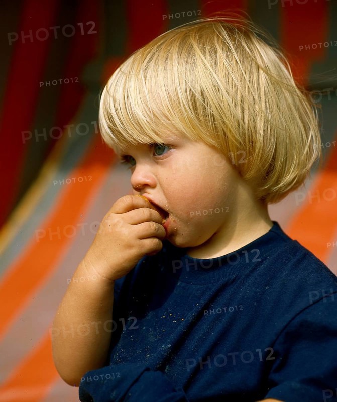 Little girl eating rusks Photo:
