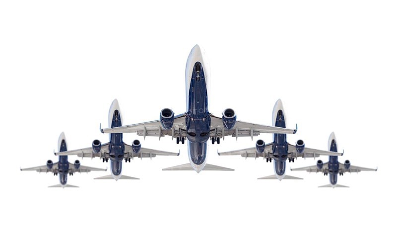 Five passenger airplanes in formation isolated on a white background