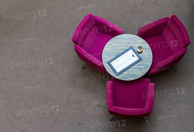 Arrangement of coloured club chairs in the restaurant