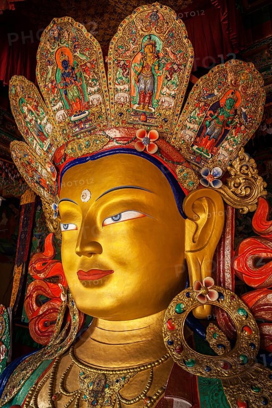 Maitreya Buddha statue face close up in Thiksey Gompa. Ladakh