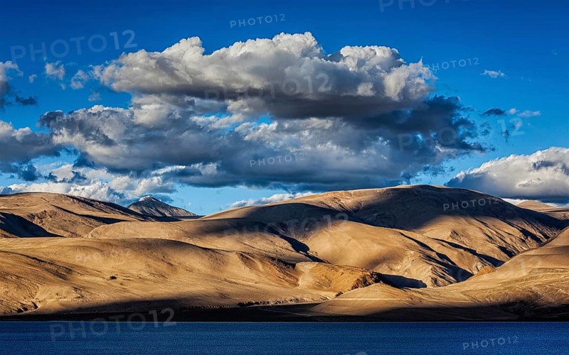 Himalayas and Himalayan mountain lake Tso Moriri on sunset. Korzok