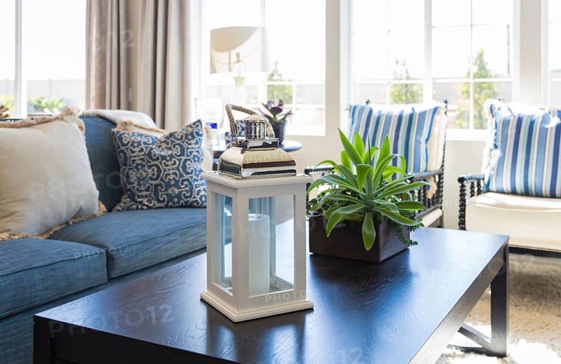 Beautiful blue accented living area with coffee table