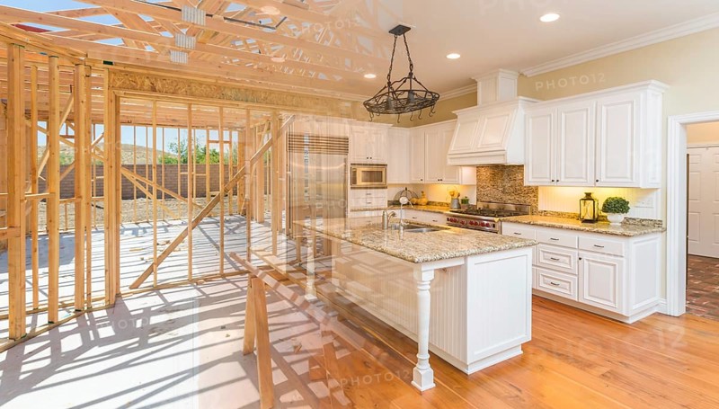 House construction framing gradating into finished kitchen build