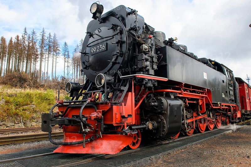 Close-up of steam locomotive with snowplough of Brockenbahn in Schierke station
