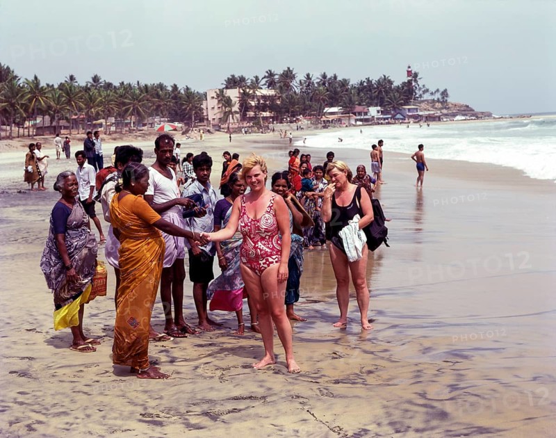 Tourists in kovalam beach