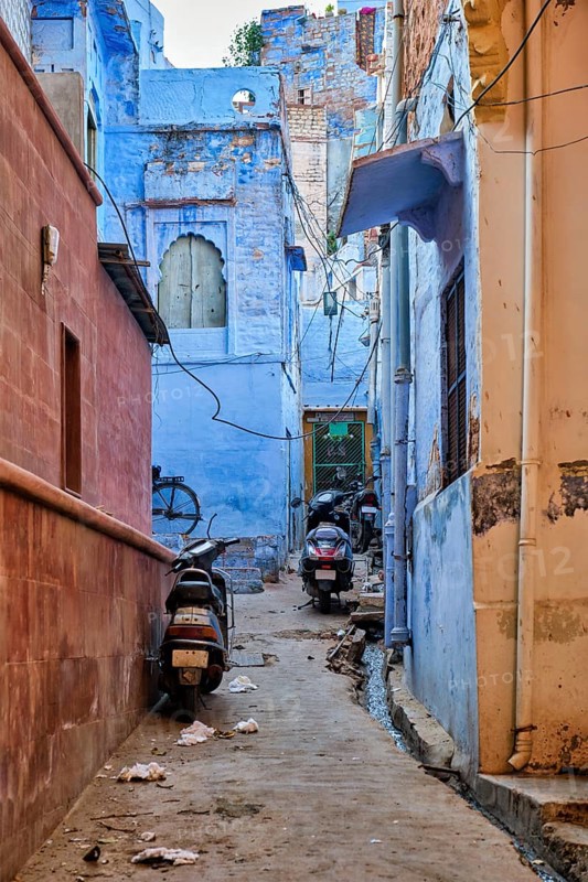 Bikes parked in indian streets of Jodphur also known as Blue City due to the vivid blue-painted Brahmin houses