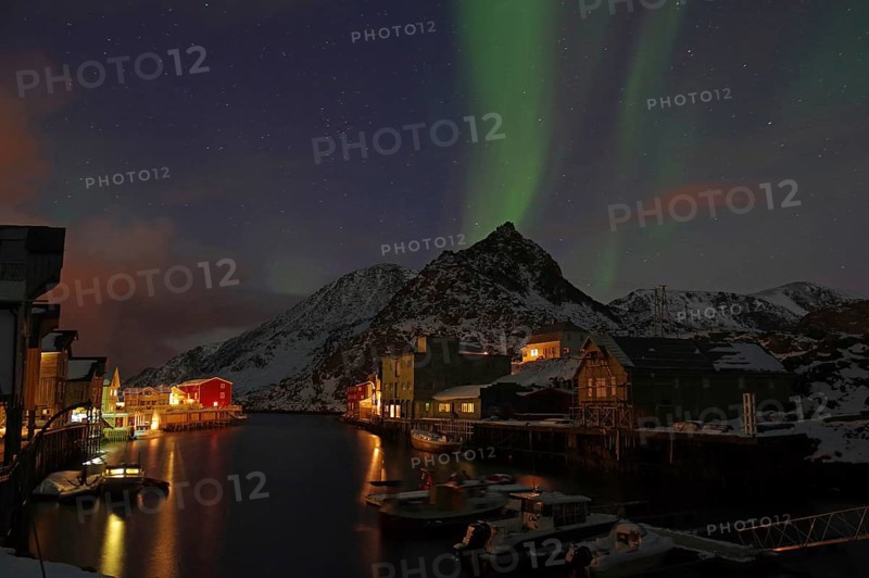 Small harbour with illuminated houses