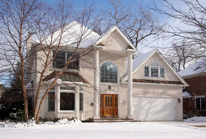 Majestic newly constructed home facade on a blustery day