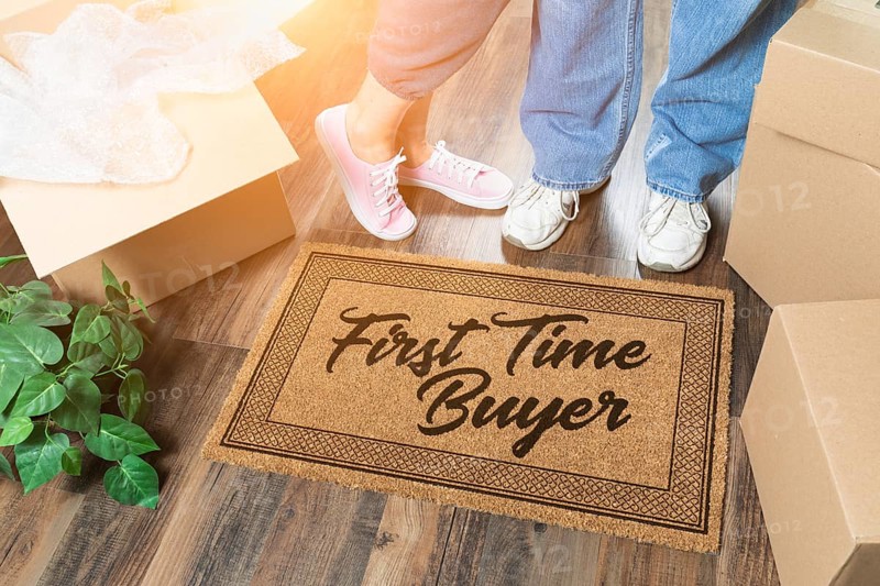 Man and woman unpacking near our first time buyer welcome mat