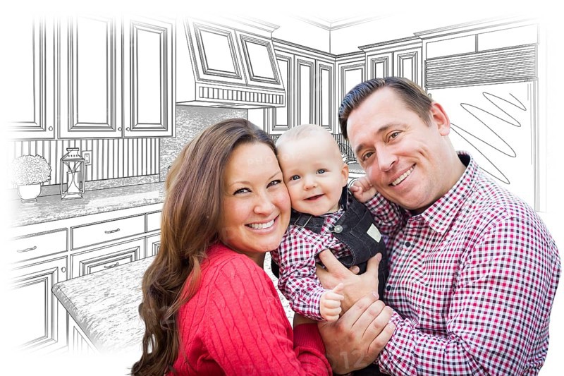 Happy young family over custom kitchen and design drawing