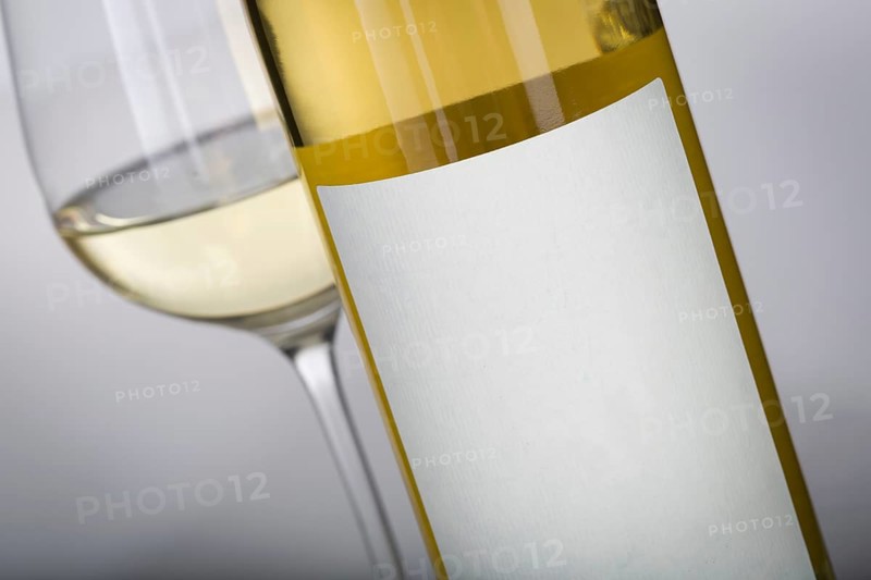 Wine glass and bottle with blank label ready for graphic and text