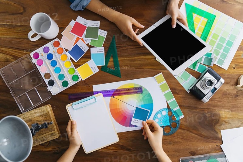 Artists working desk with colors and tools