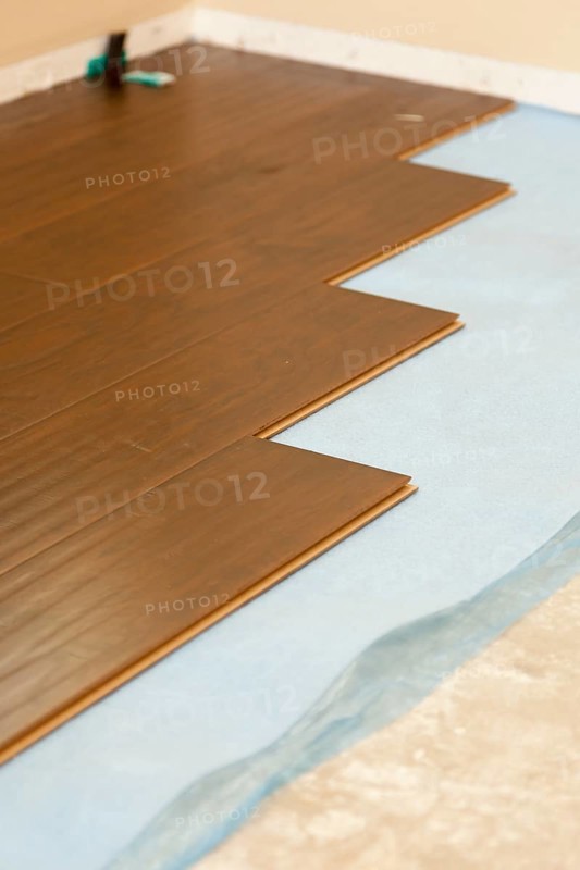 Newly installed brown laminate flooring abstract