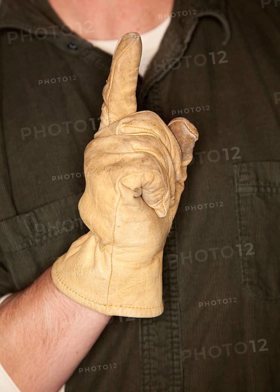 Man with leather construction glove and number one hand gesture