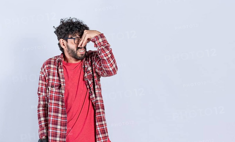 A man with covering his nose
