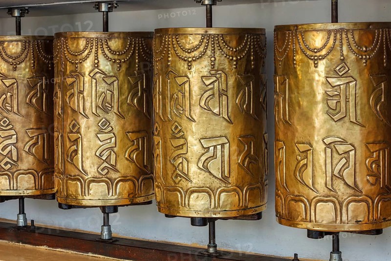 Metal buddhist prayer wheels in Tsuglagkhang complex in Dalai Lama residence
