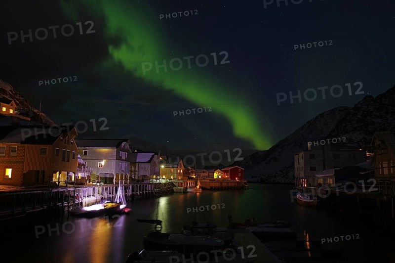 Small harbour with illuminated houses