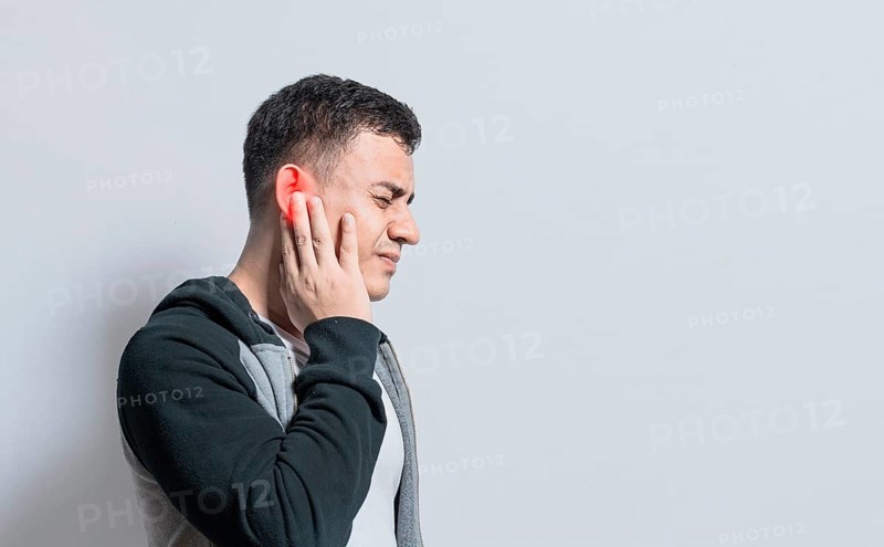 A person with otitis and tinnitus