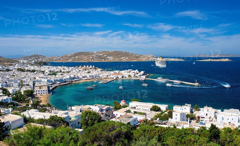 View of Mykonos town Greek holiday vacation destination with famous windmills