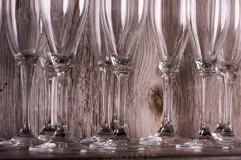 Champagne flutes on shelf abstract