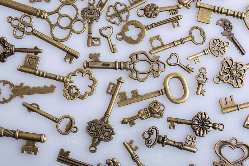Retro style metal keys on a white background