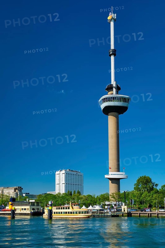 Rotterdam cityscape with Euromast observation tower and tourist boat on Nieuwe Maas river