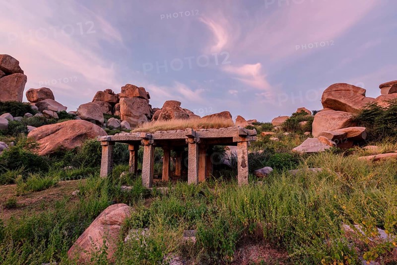 Ancient ruins in Hampi on sunset. Above Hampi Bazaar