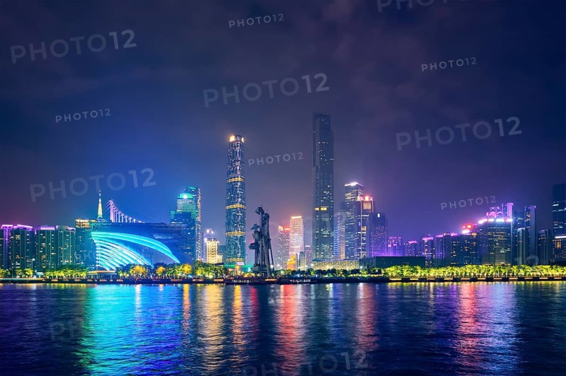 Guangzhou cityscape skyline over the Pearl River illuminated in the evening. Guangzhou