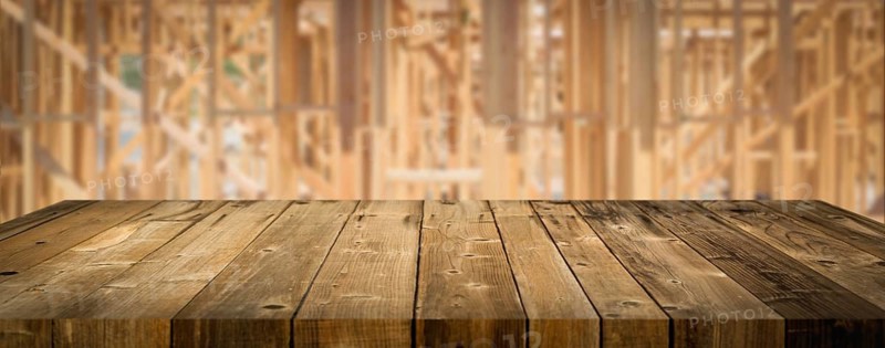 Empty wood table surface display background with construction theme behind