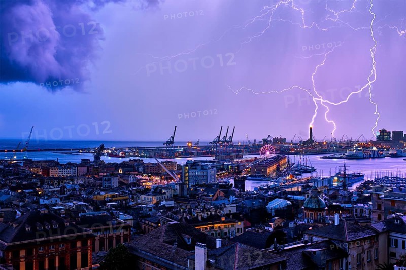Port of Genoa with port cranes and industrial area