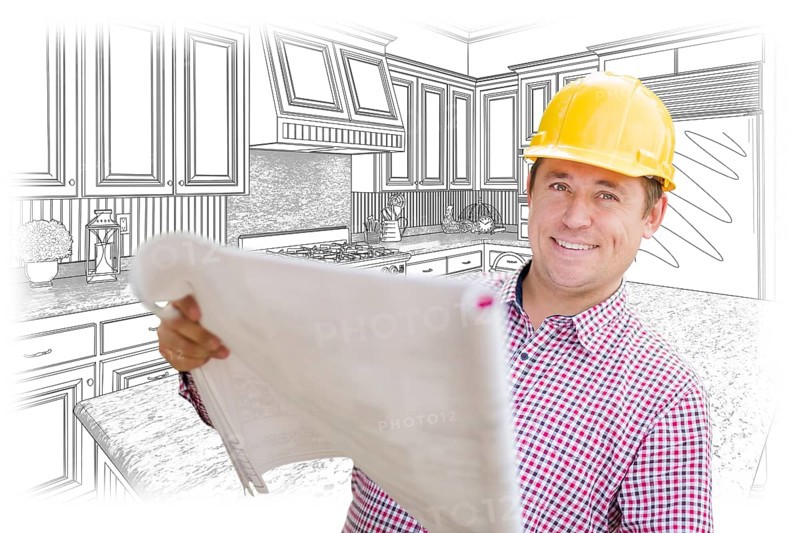 Smiling contractor holding blueprints over custom kitchen drawing