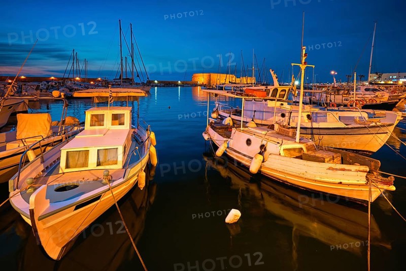 Venetian Fort Venetian fortress of Koules Castello a Mare castle in Heraklion and moored Greek fishing boats in port