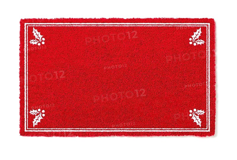 Blank holiday red welcome mat with holly corners isolated on white background