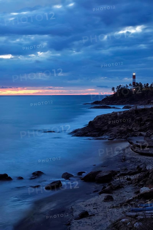 Kovalam Vizhinjam lighthouse on beautiful Arabian sea coast during sunset